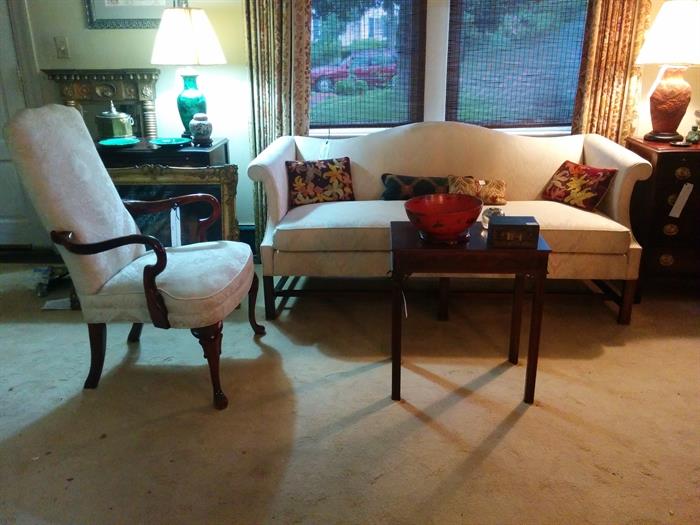 Camel back Chippendale style sofa with Queen Anne style armchair.  Exceptionally fine lamps, and handmade needlepoint pillows.