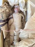 Molded bisque German doll w glass eyes