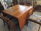 Willett cherry wood rope leg drop-leaf table with rose-back carved chairs. Table and chairs sold separately.