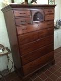 (Same) Early New England cherry wood tall chest of drawers with shell drop. Shown with replacement pulls however the original brass bail pulls and escutcheons are present and will be included with sale of the chest.