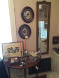 On half round table from top right: candlewick, tin, owl art, solid brass candlesticks