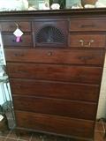 Early New England tall cherry wood chest shown here with a ingle original brass bail handle pull, the remainder of the original hardware (pulls and escutcheons) will be included with sale of the chest as they are.