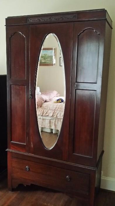 Beautiful Mahogany Armoir with oval mirror in very good shape!