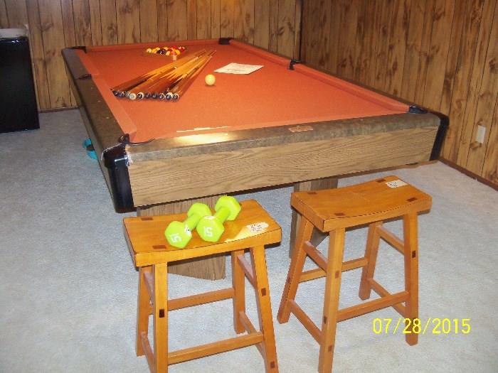 Pool table and a pair of stools
