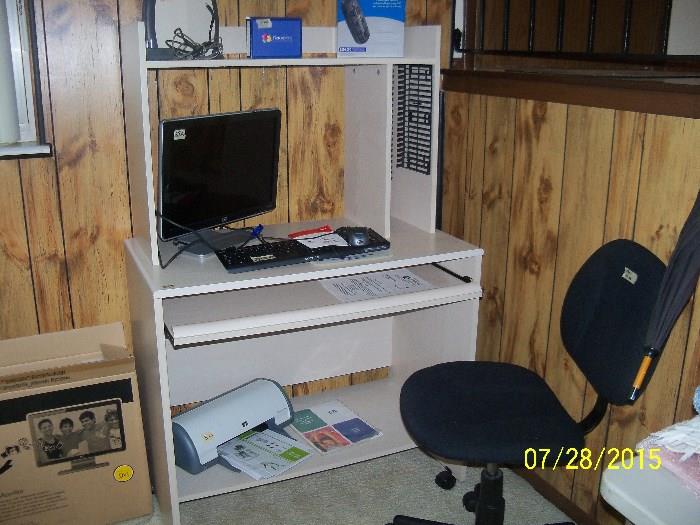 computer desk, chair, screen etc.