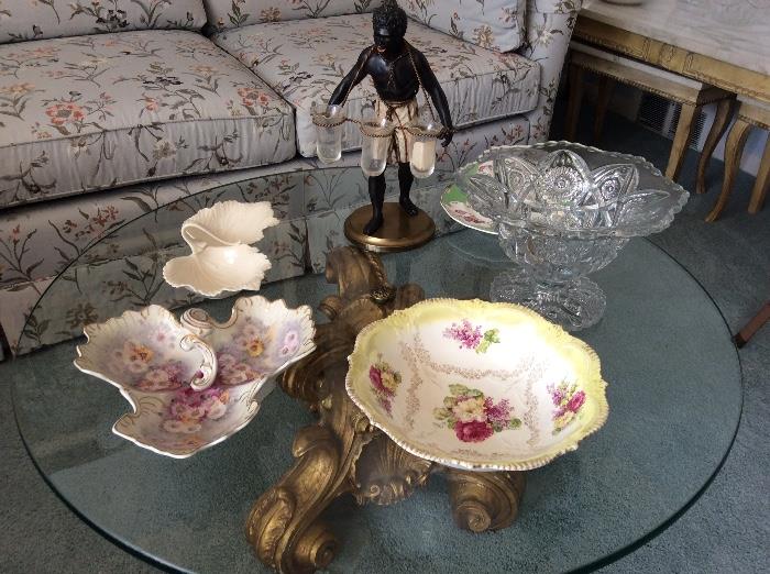Glass top cocktail table, vintage figurine, porcelain bowls and crystal