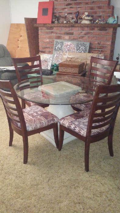 Small round class top table with 4 wood chairs with cloth seats - Large splatter Painting on canvas - wicker boxes
