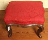 34 - Walnut foot stool with burgundy upholstery, matching fabric to chairs in lot # 33. 14 in. T, 19 in. W, 16 in. D.

