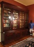 47 - Mahogany Empire bookcase with 8 doors, original to Lauri Mundi, 9 ft. T, 10 ft. W, 23 in. D.
