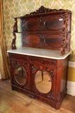 50 - Mahogany rococo parlor cabinet with marble top and mirrored doors, pierce carved crown, 70 in. T, 50 in. W, 22 in. D.

