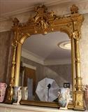 52 - Magnificent gold gilt over the mantle mirror with carved Egyptian crown and sides, Original to Lauri Mundi, 7 ft. T, 67 in. W.
