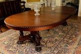 62 - 60 in. mahogany Empire table with carved columns and claw feet, 5 original leaves, 60 in. R.

