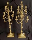 63 - Oversize set of 10 light brass candelabra, 36 in. T, 13 in. W.
