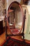 76 - Acanthus carved mahogany cheval mirror in original finish with claw feet, 64 in. T, 33 in. W.
