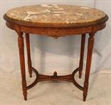 86 - Walnut Victorian oval marble top table, 30 in. T, 33 in. W, 22 in. D.
