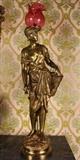 93 - Dore bronze newel post lamp signed Rousseau with cranberry art glass  shade, 45 in. T, 13 in. W.
