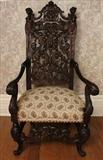 100 - Rosewood pierce carved arm chair, very fine with heads in crown, ca. 1880, 55 in. T, 26 in. W, 22 in. D.
