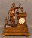 117 - French bronze figural clock with key, 20 in. T, 16 in. W, 6 in. D.
