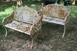 121 - Matched pair cast iron garden benches with lady and bird on front crest, extremely heavy, 36 in. T, 41 in. W, 15 in. D.
