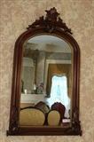168 - Walnut Victorian hanging mirror with carved mounts, 44 x 24.
