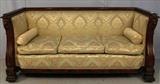 207 - Solid mahogany Empire library sofa with cupid heads, claw feet, green and gold upholstery, in mint condition, 39 in. T, 82 in. W, 24 in. D.
