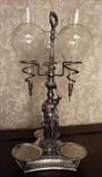 209 - Silver-plate figural wine dispenser with female figure, 24 in. T, 12 in. W.
