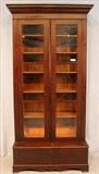 215 - Mahogany Empire 2 piece bookcase with adjustable shelves and original finish, has cracked glass, 84.5 in, T, 40 in. W, 19 in. D.
