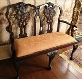 282 - Mahogany 19th Century double chair back settee with carved crest, ball and claw feet and peach upholstery, ca. 1880, 42 in. T, 50 in. W, 19 in. D.
