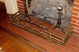 290 - Brass fireplace set of andirons and fender, 19 in. T.
