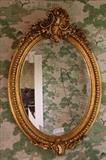 299 - Victorian oval gold leaf beveled mirror, 37 x 24.5.
