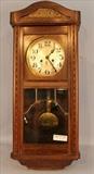 306 - Mahogany windup double wall clock with beveled glass, 29 x 13.

