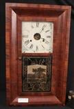346 - Empire ogee mantle clock by New Haven Clock Co., with weights, pendulum and key, has reverse paint, 26 in. T, 15 in. 4 in. D.
