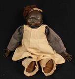 352 - Black memorabilia doll in period clothing made of beans, 20 in. T.
