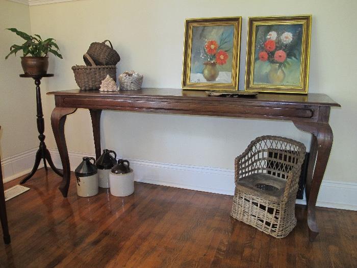 Imported console table...and look at that antique wicker child's potty chair. 