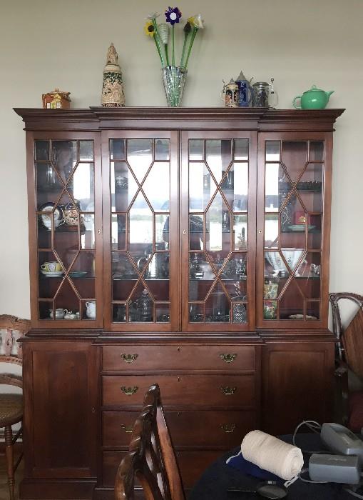 CRAFTIQUE ONE OF A KIND MADE BY ONE CRAFTSMAN MAHOGANY CHIPPENDALE DOORED CABINET AND A MATCHING DINING TABLE AND CHIPPENDALE CHAIRS