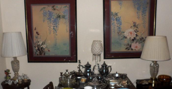 Two very beautiful large pictures. Assortment of silver serving pieces. Including a tea and coffee set with tray, sugar and creamer.
