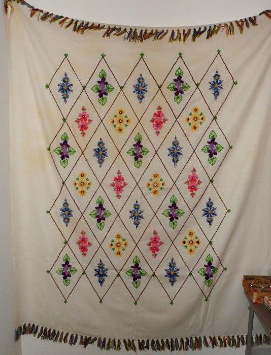 Hand made flower embodied throw.