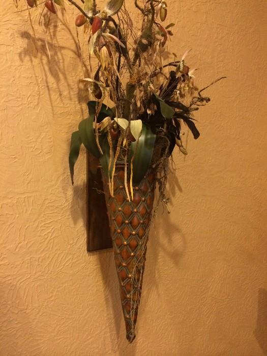 One of two cone-shaped wall decor arrangements
