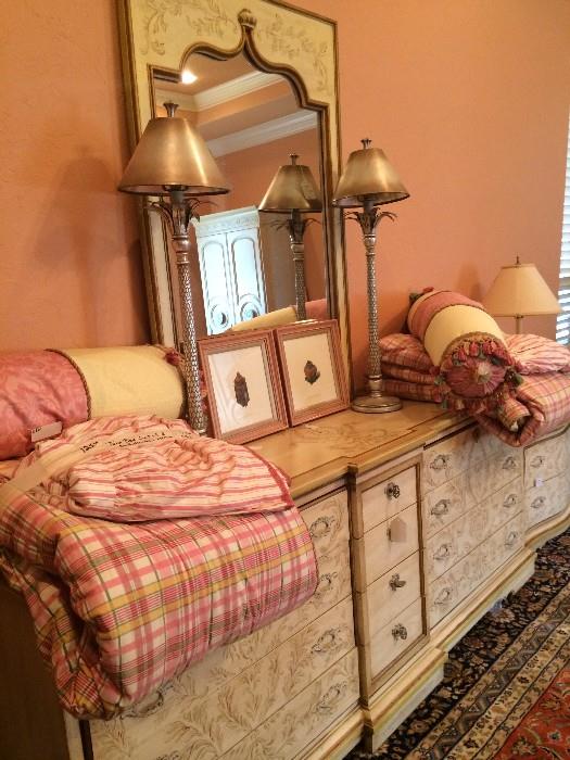 Large triple dresser has 2 matching bed side chests; pair of lamps; custom twin bedding