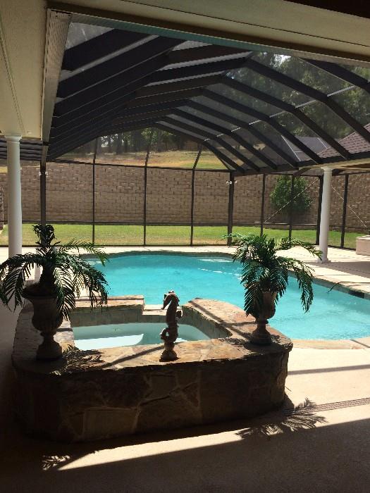 The screened-in pool area is a special feature of this lovely home.