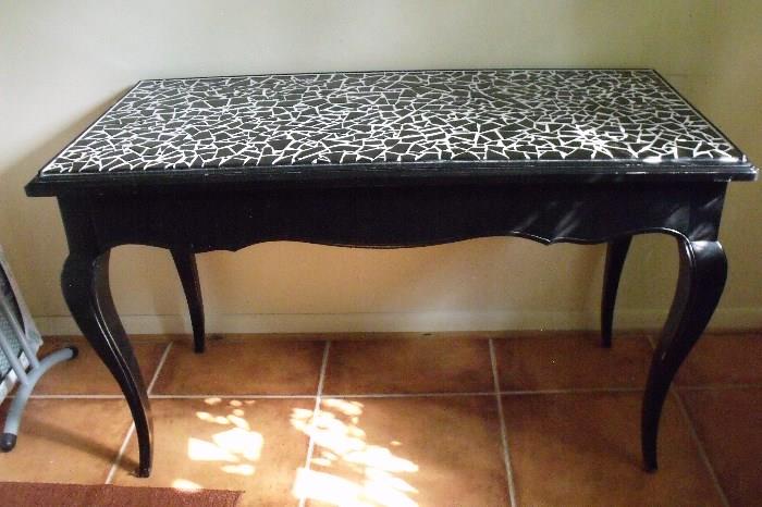 French provincial desk 50 inches x 24 inches. Front is a pull-out drawer. Black ceramic tile mosaic with white grout. 