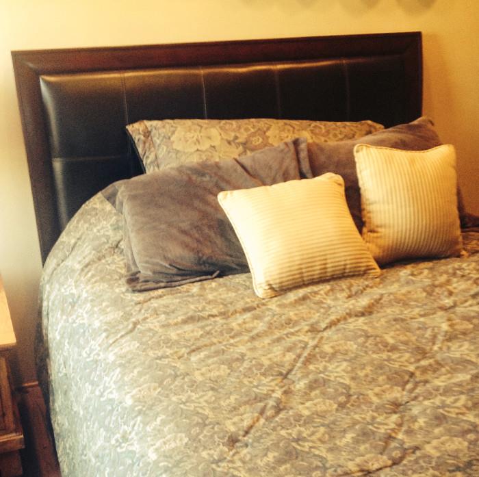 "Espresso" and leather queen size headboard, foot board, and mattress. (Matching end tables available.)