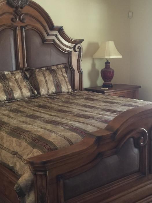Beautiful king-sized leather and wood headboard, foot board with matching night stands. Mattress may be available.