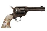 Lot 120: Wonderful Colt SAA single action Army chambered in
32 W.C.F (or 32-30), 5" bbl. with custom carved AAA mother of
pearl grips with sculpted Elk on right side (Small loss to upper right)
no pits, a tight classic weapon, est. $1,500.00-$2,000.00