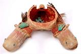 Lot 114: RARE Zuni Ceremonial deer skull cap prayer fetish having 2
horn bases carved into lizard heads with turquoise eyes, having
2 offerings of turquoise and feathers on each horn and turquoise
stones inside the cap, measuring 7.25" x 6.75" x 2.75", NEVER
offered for sale est. $800.00-$1,200.00