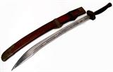 Lot 33: Chinese ox-tail Dao sword having a 29" blade with an engraved
flying eagle, engraved copper daodaang, bingtou and tiliang'gu, 
measuring 38" long, early 20th cen., est. $200.00-$400.00