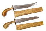 Lot 136: Pair of Indo-Persian daggers with etched blades, the kris blade
having a central copper inlay, both having brass handle collars, 
the kris having an engraved brass handle, both with brass engraved
scabbards, both in fine condition, est. $300.00-$500.00