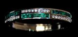 Lot 123: Estate 14K emerald diamond hinged bangle set with 20 square cut 
Columbian emeralds approx. 4 carats TCW accented with 27 round
brilliant cut diamonds approx. 3 carats, weighing 30 grams, retail
replacement value $13,900.00 est. $3,000.00-$4,000.00