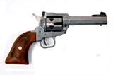Lot 8: H. S. model 21 Texas Scout .22 Magnum 6 shot SA with adjustable
sights, wooden grips, West Germany mfg. in excellent working order
60% finish est. $125.00-$175.00