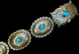 Lot 119: Vintage Navajo sterling turquoise concho belt bezel set with
Ithaca Peak gem quality turquoise cabochons in each of the 8 conchos
and the buckle, each concho measuring 4" x 3", the buckle measuring
4.5" x 3", weighing approx. 869 grams c.1950's-1960's
 est. $1,500.00-$2,200.00